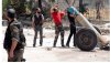 syrian-rebels-fire-mortar.jpg