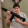 Isaiah with AR Pistol.jpg