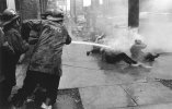 Firemen_turn_fire_hoses_on_demonstrators_Birmingham_Alabama_1963_Photo_by_Charles_Moore.jpg