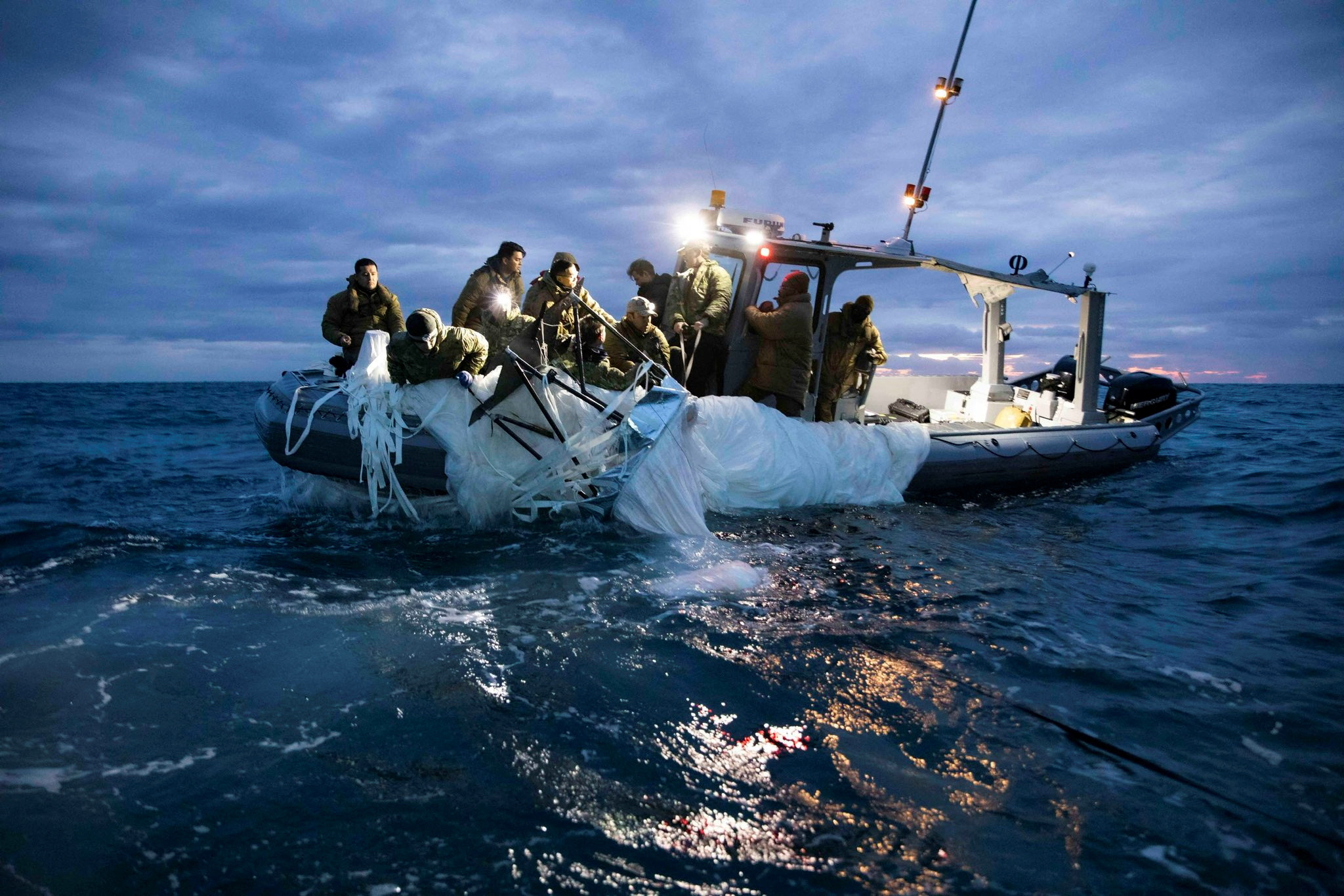 Sailors recover a high-altitude surveillance balloon off the coast of Myrtle Beach, South Carolina