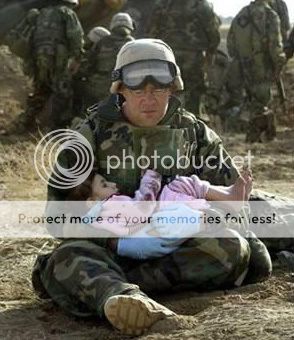 iraq-soldierHoldingIraqiChild.jpg